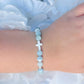 White Cross & Aquamarine Beaded Bracelet The Cole Collection