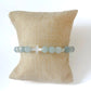 White Cross & Aquamarine Beaded Bracelet The Cole Collection